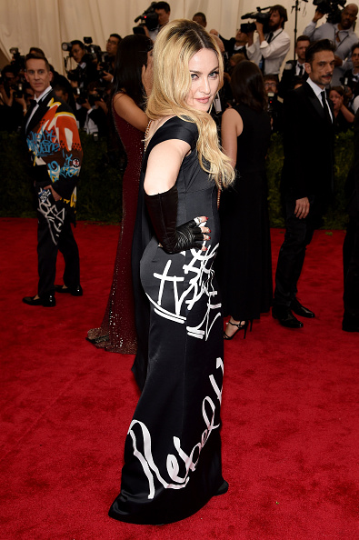 Madonna wrote her own script in this black strapless gown by Moschino with Rebel Heart scribbled on the front. 